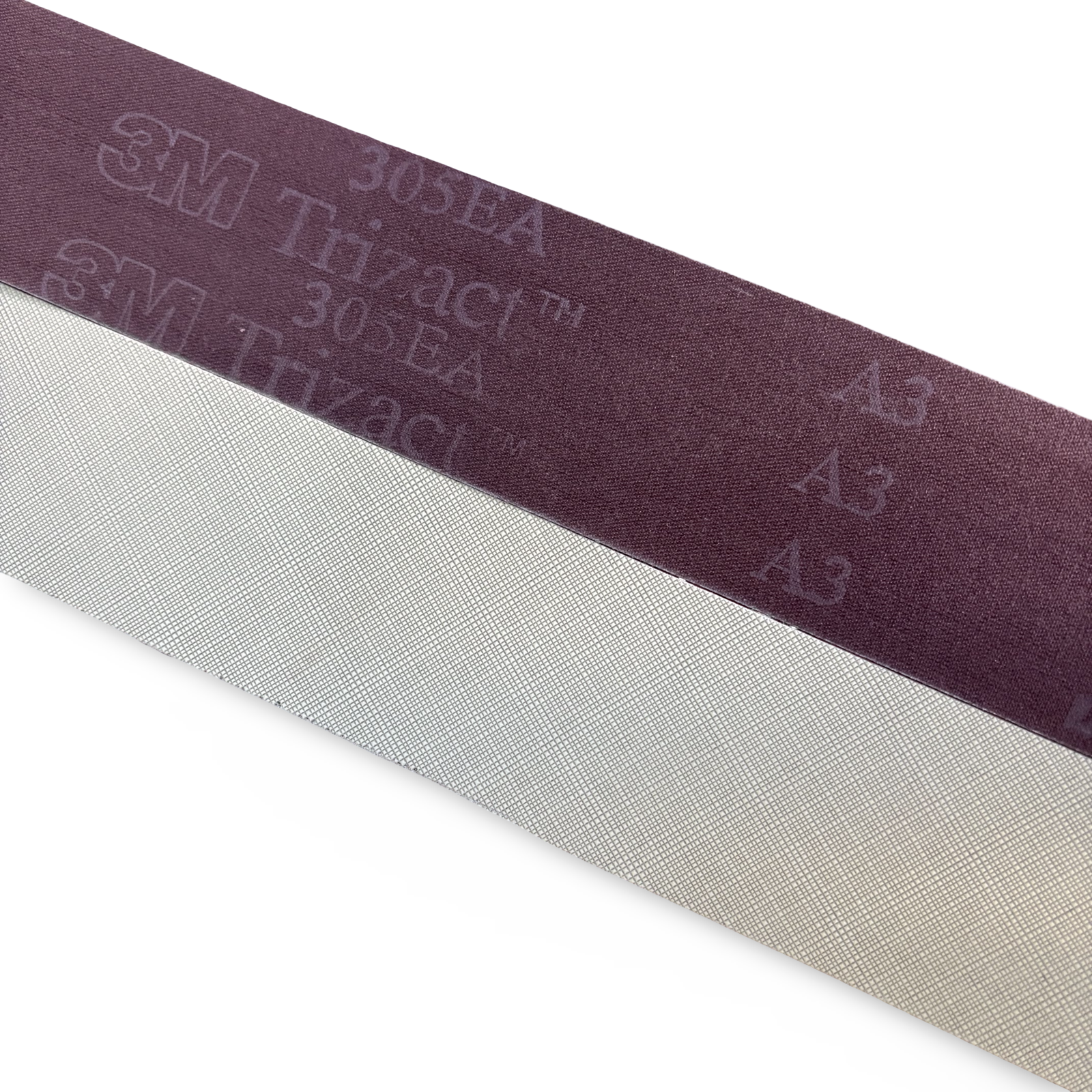 A close-up of a 3M Trizac1 305EA sanding belt showing its dark purple abrasive side and the light gray textured backing, set against a plain white background.
