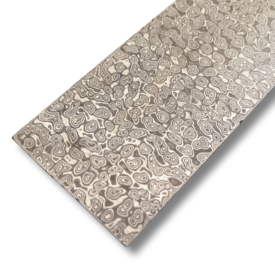A bar of steel with a raindrop Damascus pattern