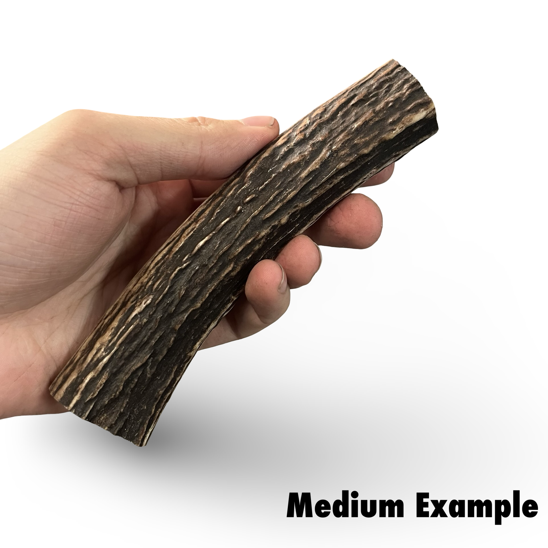 Hand holding a antler product with a white background
